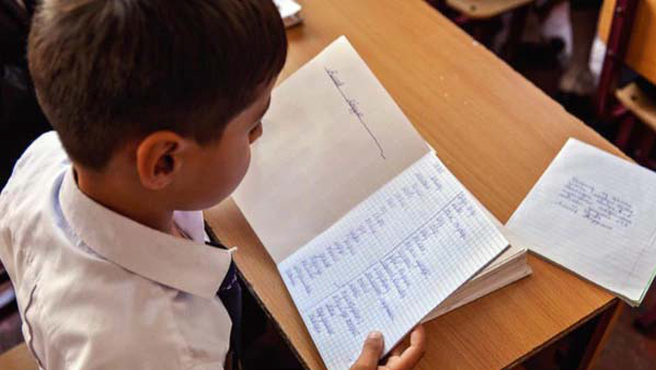 Tajik boy doing word study