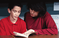 Teacher reading to boy