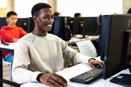 Young African American man working at desktop